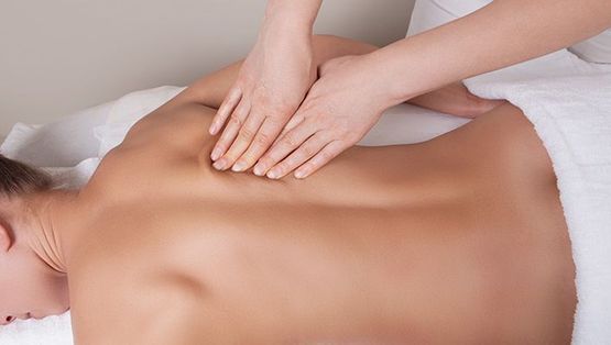 Deep tissue massage on womans back